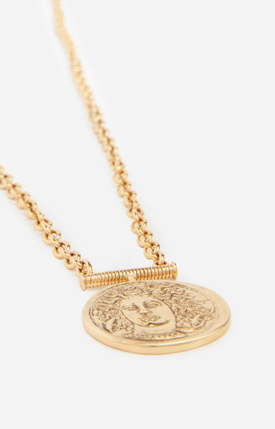 MEDALLION LONG BRASS NECKLACE